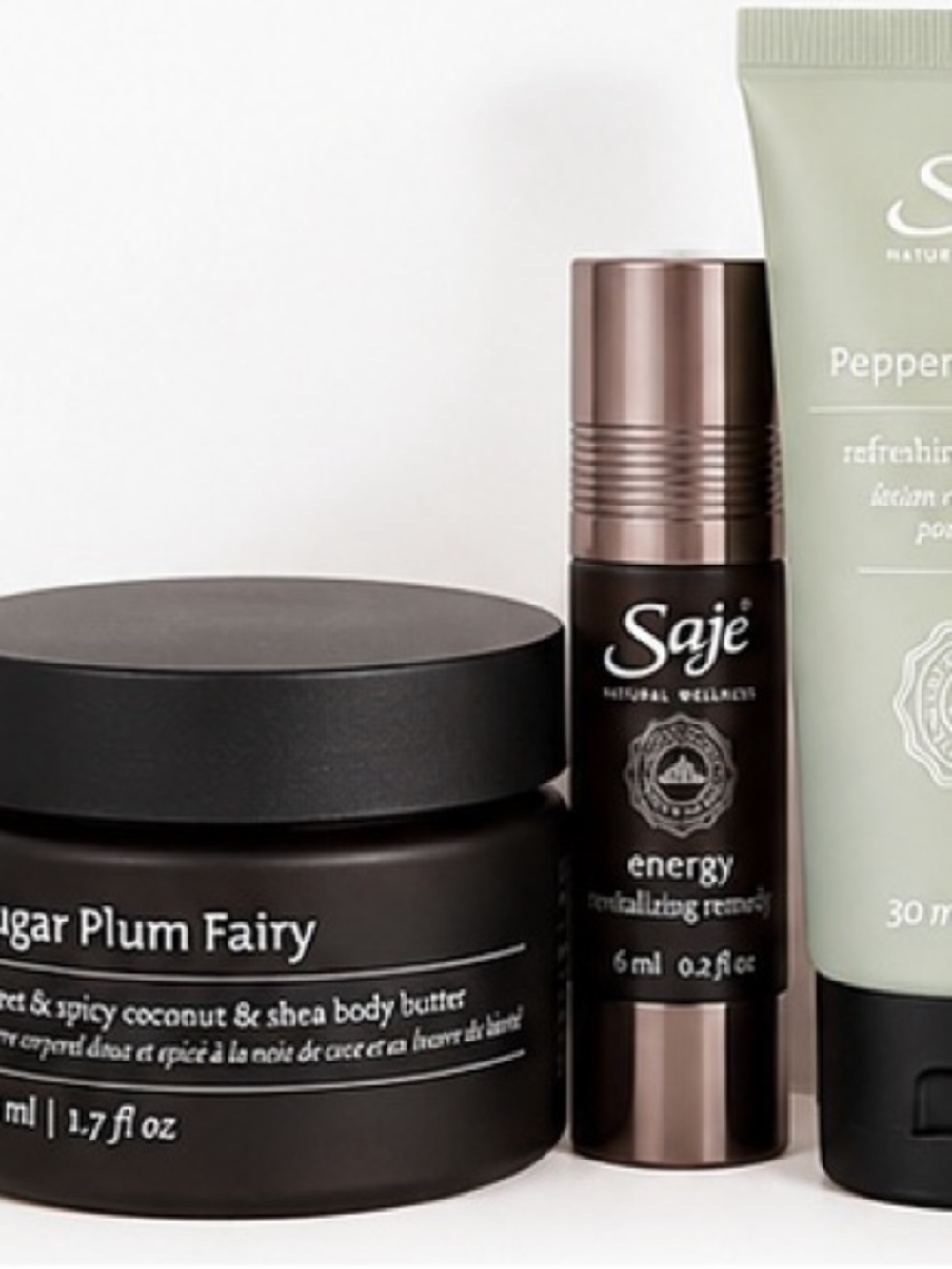 Saje Energy Revitalizing Roll-On in Black and Bronze